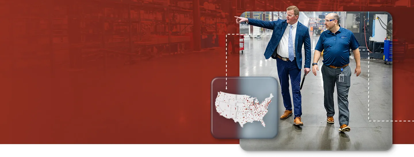 A Federated marketing representative tours a warehouse with a Federated client