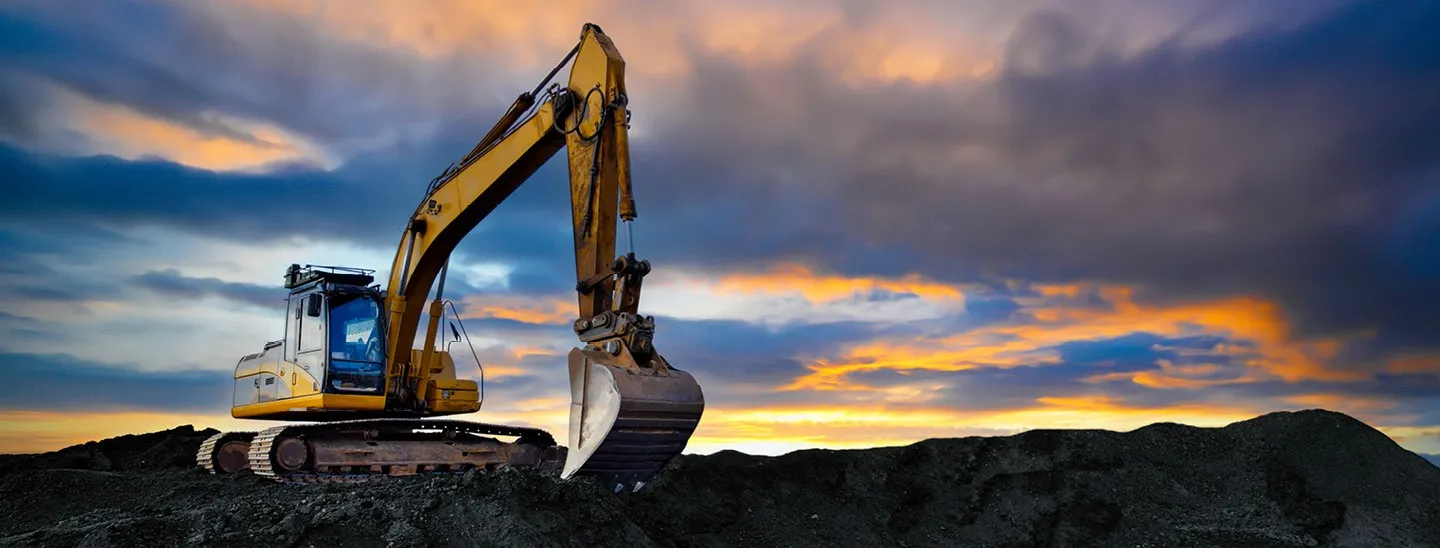 Heavy construction excavator at a worksite, representing specialized insurance coverage for equipment dealerships and heavy equipment operations. Explore specialized insurance solutions designed for equipment dealerships, protecting inventory, operations, and heavy equipment throughout every stage of your business.