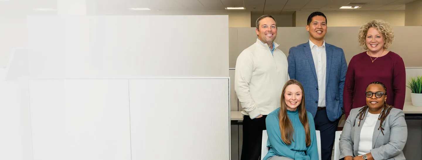 Professional staff in a corporate office setting at Federated Insurance, highlighting a collaborative and inclusive workplace.