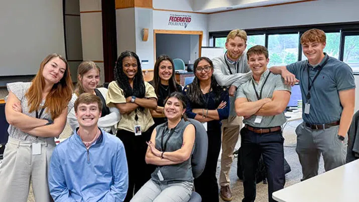 Internship program participants collaborating in a modern office setting, showcasing early career opportunities and professional growth.