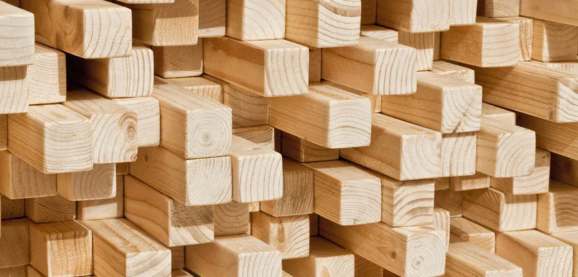 Stacked kiln-dried lumber pieces showcasing smooth finish and durability, supplied by National Lumber and Building Material Dealers Association (NLBMDA).